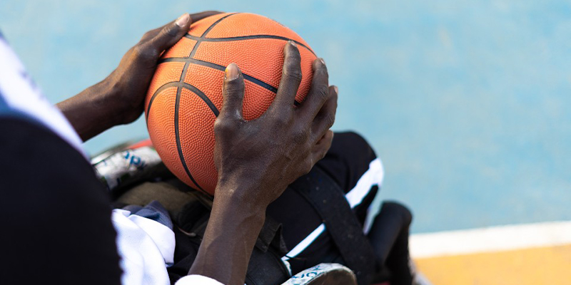 A basketball being held in two hands