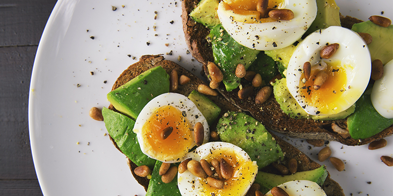 Eggs, avocado and seeds on some toast