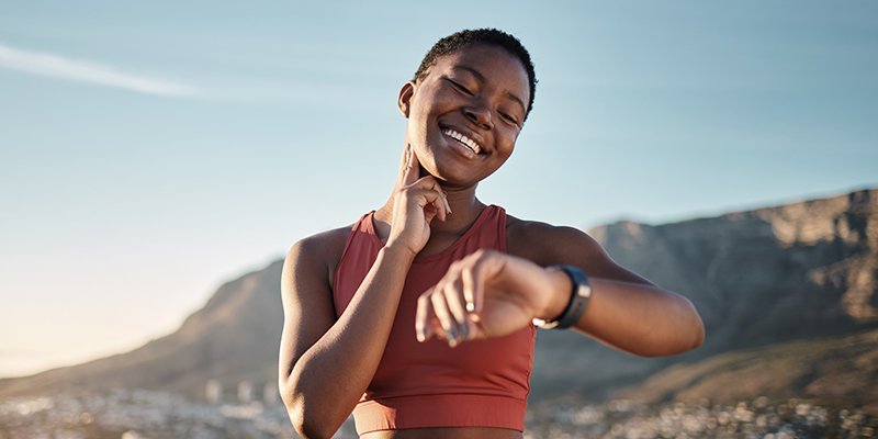 Black woman, fitness or smart watch for pulse check in nature workout, training or sunset exercise for cardiovascular healthcare. Smile, happy or sports runner with heart rate clock for body wellness.